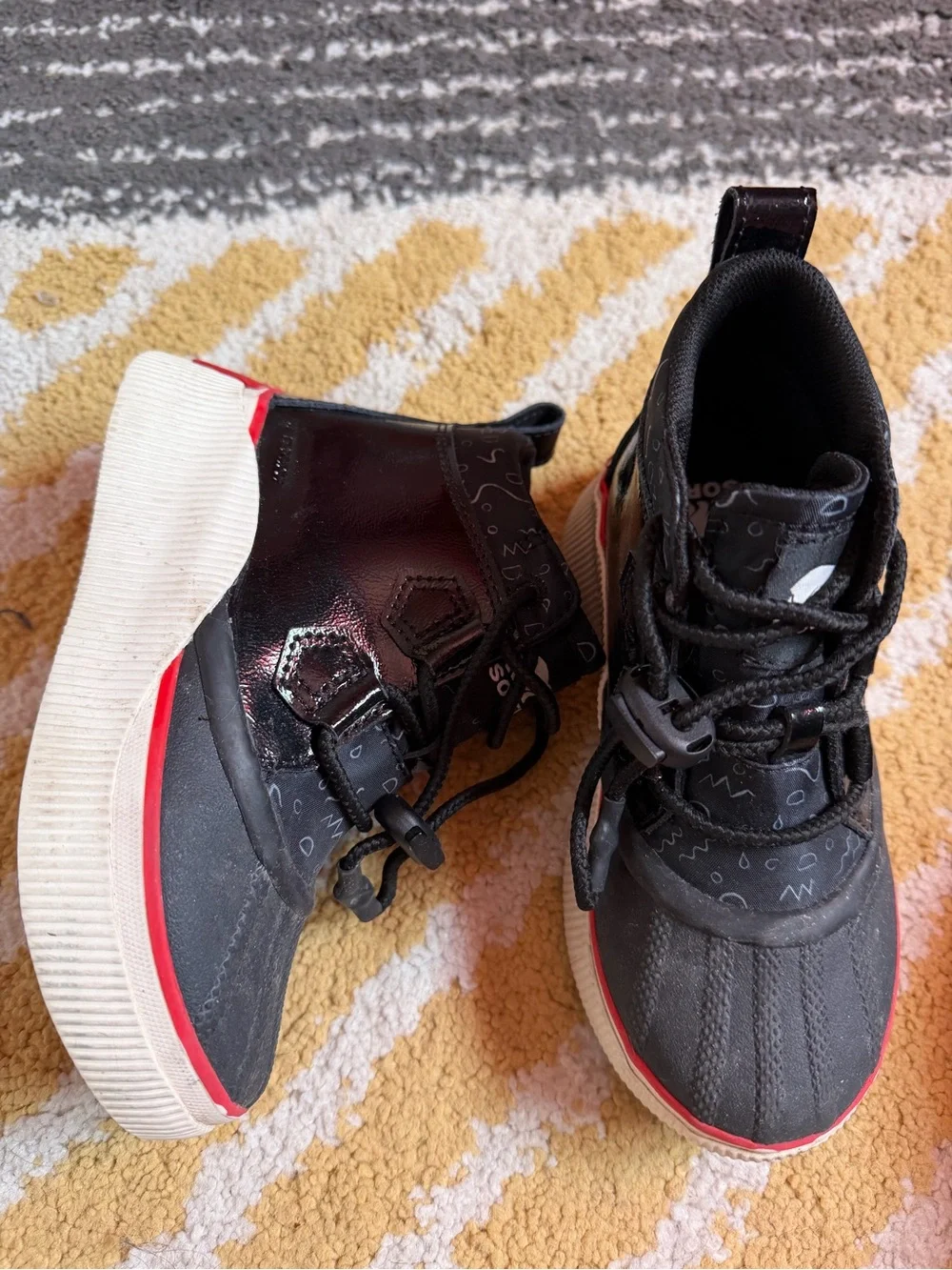 Sorel Kids Black Boots with Red Trim